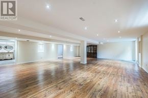 Milton (Be Beaty) apartment for rent - A large, empty room with wooden floors and white walls.