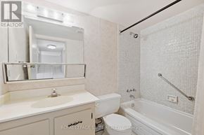 Hamilton (Durand) condo for rent - A room with a sliding door and wooden flooring.