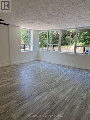 Hamilton (Durand) condo for rent - A white laundry room with a washer and dryer.