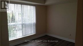 Toronto (Willowdale West) condo for rent - A room with a window and a sign that says "RETEND REALTY LTD, Brokerage".