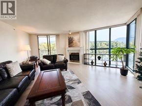 Coquitlam apartment for rent - A living room with a black leather couch and a wooden coffee table.