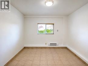 Richmond apartment for rent - A white room with a window and a tiled floor.