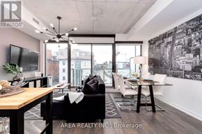 Toronto (Waterfront Communities) condo for rent - A modern living room with a view of the city.