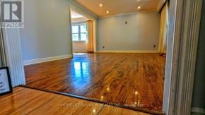Markham (Royal Orchard) apartment for rent - A spacious room with wooden flooring and a large window.