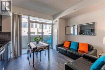 Burlington (Lasalle) condo for rent - A modern living room with a dining table and a couch.