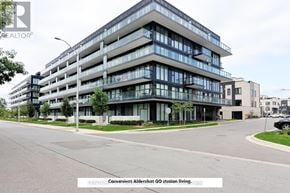 Burlington (Lasalle) condo for rent - A modern multi-story building with a glass facade and balconies.