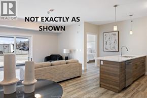 Lasalle condo for rent - A real estate listing photo of a kitchen and living room with a disclaimer that it is not exactly as shown.