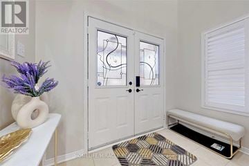 Mississauga (Churchill Meadows) apartment for rent - A white door with a glass panel and a black handle.