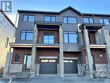 Ottawa townhouse for rent - A modern two-story building with a brick facade and large windows.