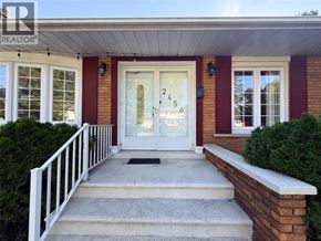 Windsor apartment for rent - A house entrance with a number 245 on the glass door.