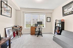 Thorold (Hurricane/Merrittville) townhouse for rent - A room with a desk, chair, and bookshelf.