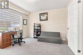 Thorold (Hurricane/Merrittville) townhouse for rent - A room with a desk, chair, and bookshelf.