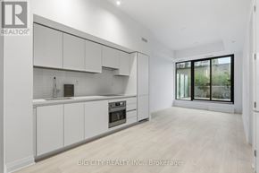 Toronto (Thorncliffe Park) condo for rent - A white kitchen with a window seat.