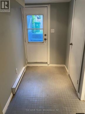 Toronto (South Riverdale) apartment for rent - A hallway with a door leading to a balcony.