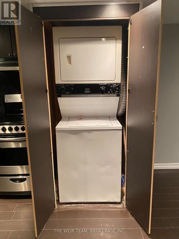 Toronto (South Riverdale) apartment for rent - A white dishwasher is open in a kitchen.