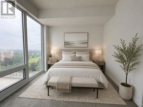 Toronto (Humber Heights) condo for rent - A bedroom with a large bed and a view of the city.