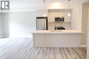 Lakeshore condo for rent - A kitchen with a white countertop and a refrigerator.