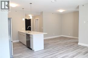 Lakeshore condo for rent - A kitchen area with a white countertop and a refrigerator.