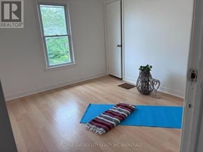 Welland (Lincoln/Crowland) multi-family for rent - A room with a blue yoga mat on the floor.
