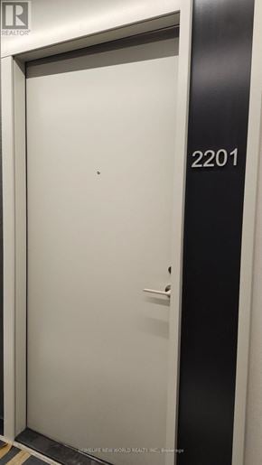 Toronto (Waterfront Communities) condo for rent - A white door with a black frame and the number 2201 on it.