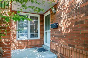 Mississauga (Meadowvale Village) apartment for rent - A red brick house with a white door and window.