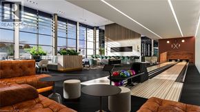 Kitchener condo for rent - A bowling alley is set in a modern living room.