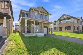 Hamilton (Stoney Creek Mountain) apartment for rent - A house with a lawn in front of it.