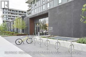 Toronto (Englemount-Lawrence) condo for rent - A bicycle is parked in front of a building with the number 120 on it.