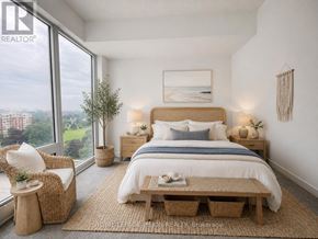 Toronto (Humber Heights) condo for rent - A bedroom with a large bed, a chair, and a table with a tray of food on it.