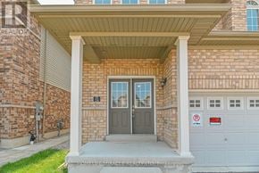 Cambridge apartment for rent - A brick house with a grey door and a sign on the wall.