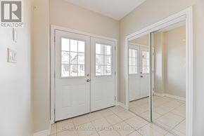 Cambridge apartment for rent - A white interior with a door and a window.