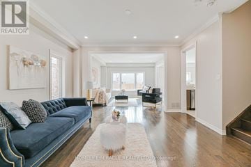 Cambridge apartment for rent - A living room with a blue couch and a white rug.