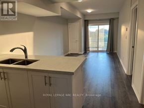 Niagara Falls (Morrison) condo for rent - A kitchen with a sink and cabinets is shown in this image.