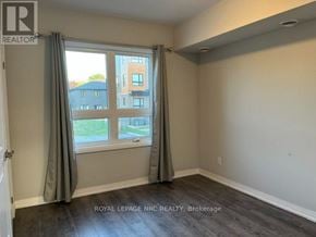 Niagara Falls (Morrison) condo for rent - A room with a large window and curtains, with a view of a building outside.