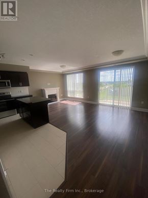 Woodstock (Woodstock - South) condo for rent - A spacious living room with a fireplace and sliding glass doors.