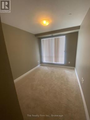 Woodstock (Woodstock - South) condo for rent - A room with a carpet floor and a window with blinds.
