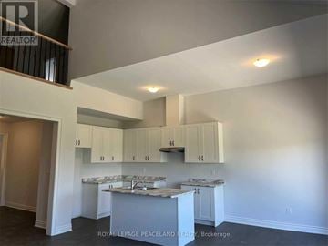 Uxbridge townhouse for rent - A kitchen with white cabinets and a countertop.