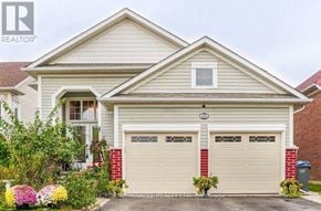 Brampton (Northwest Sandalwood Parkway) apartment for rent - A two-car garage is attached to a house.