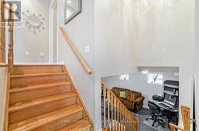 Brampton (Northwest Sandalwood Parkway) apartment for rent - A home office with a desk and a chair is visible from the staircase.