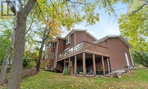 Mississauga (Clarkson) apartment for rent - A large two-story house with a balcony and a deck.