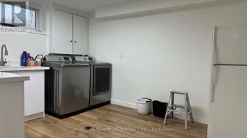 Mississauga (Clarkson) apartment for rent - A kitchen with a white countertop and a stainless steel dishwasher and oven.
