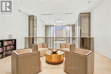 Burlington (Brant) condo for rent - A living room with a large sofa and a coffee table.