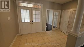 Vaughan (Patterson) apartment for rent - A room with a white door and a window with a white frame.