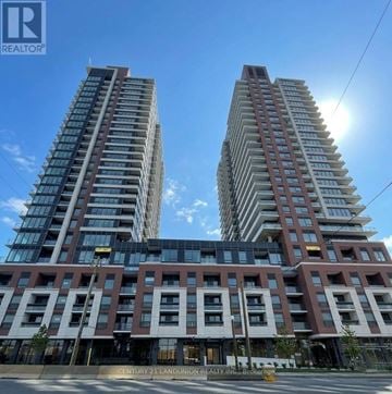 Toronto (Humber Heights) condo for rent - Two tall residential buildings with balconies and windows are shown in the image.