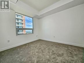Toronto (Humber Heights) condo for rent - Empty room with a window showing a building outside.