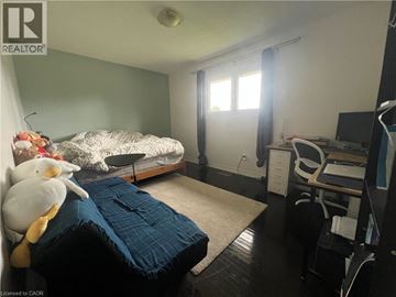 Hamilton apartment for rent - A bedroom with a bed, desk, and chair.