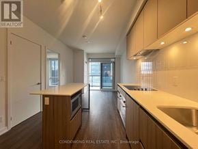 Vaughan (Beverley Glen) condo for rent - A kitchen with wooden cabinets and a stainless steel sink.