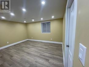 Mississauga (Central Erin Mills) apartment for rent - A room with wooden flooring and a white door.
