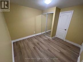 Mississauga (Central Erin Mills) apartment for rent - A room with wooden flooring and a white door.