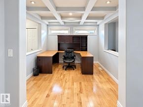 Edmonton apartment for rent - A room with wooden floors and a desk with a chair.